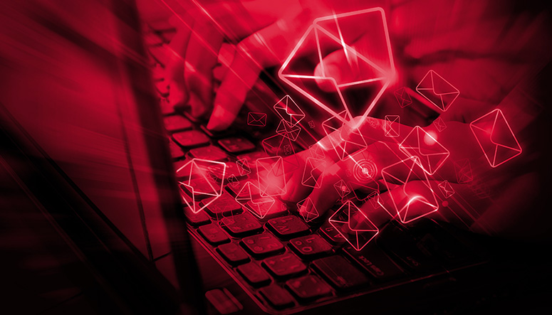 graphic of hands typing on a laptop, with email envelopes layered on top of the image, with a red overlay